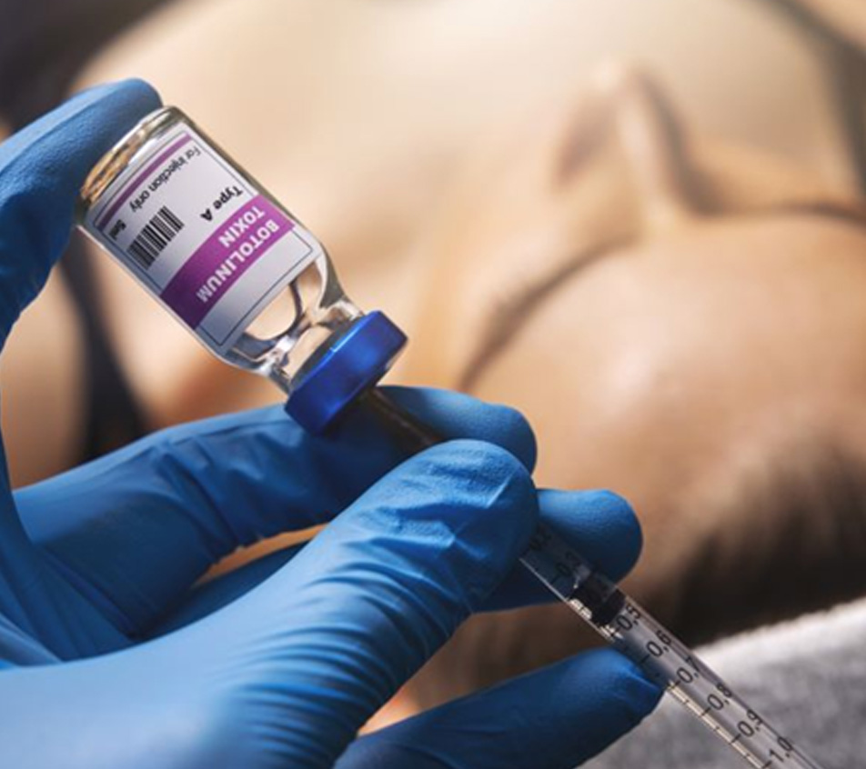 Gloved hand preparing BOTOX injection