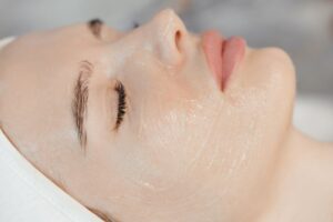 Woman relaxing while wearing a gel skincare mask